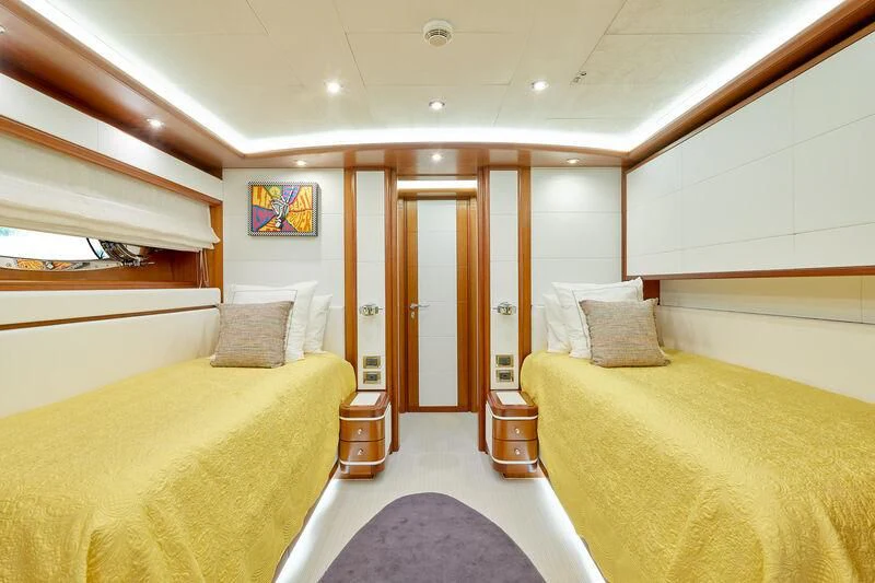 a room with a bed and a door aboard BUNKER Yacht for Sale