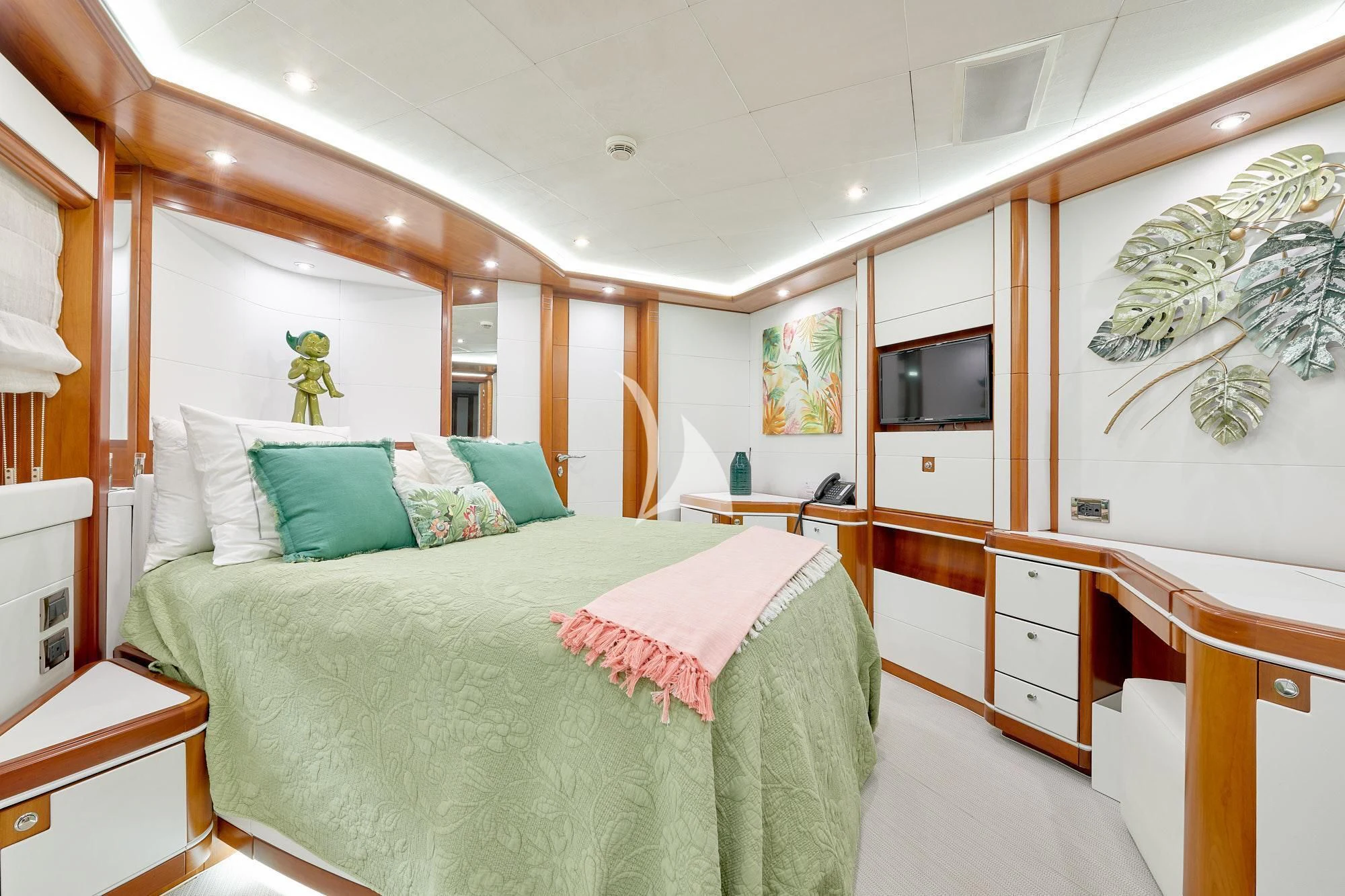 a bedroom with a bed and a desk aboard BUNKER Yacht for Sale