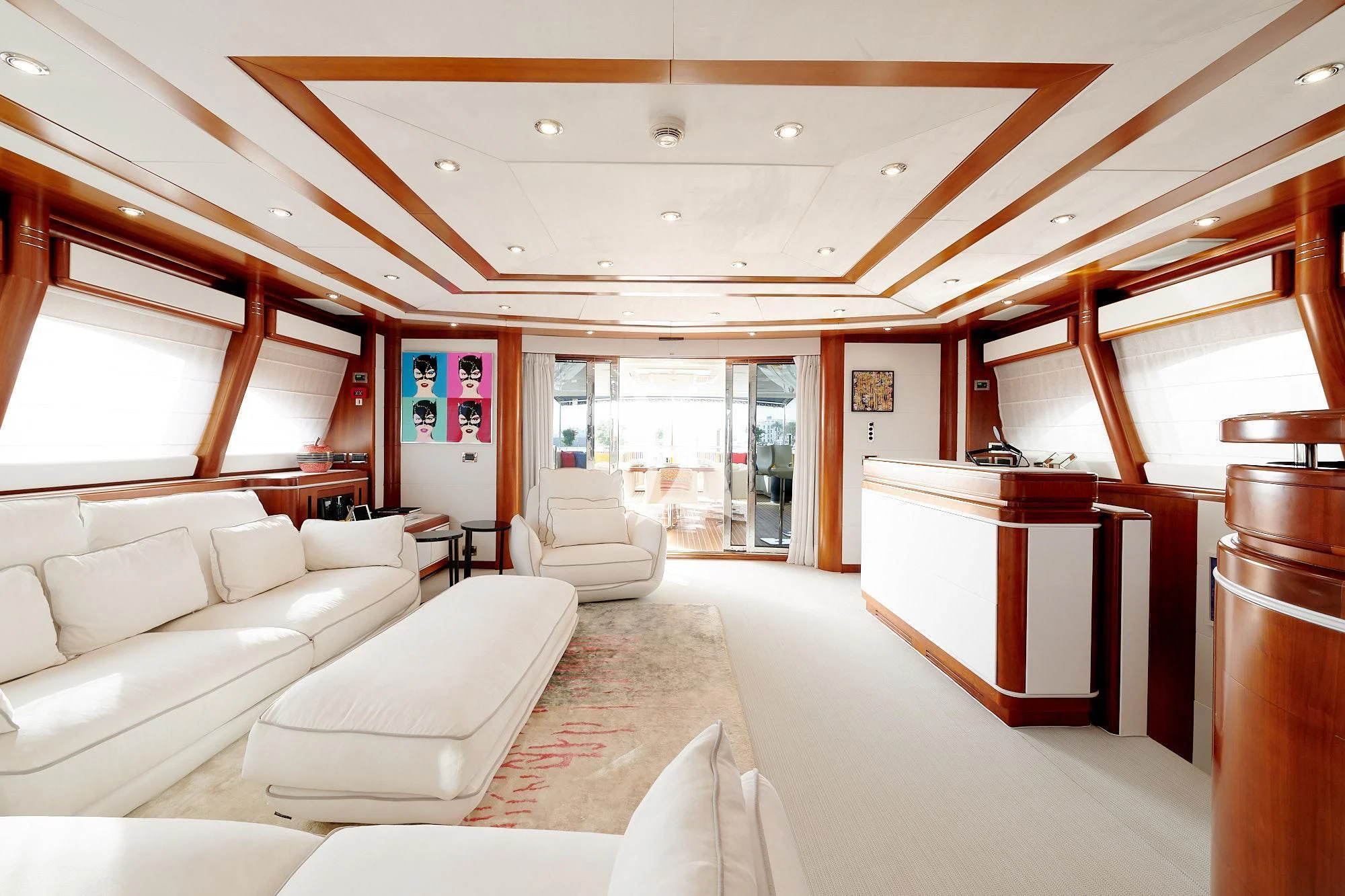 a room with a couch and a table aboard BUNKER Yacht for Sale
