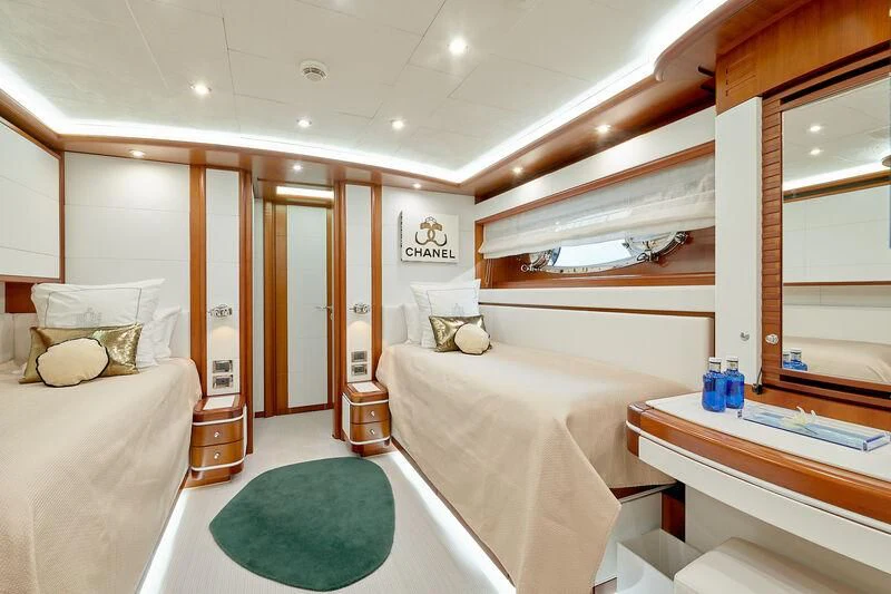 a bedroom with a bed and a sink aboard BUNKER Yacht for Sale