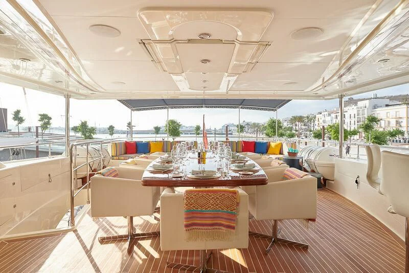 a room with a table and chairs aboard BUNKER Yacht for Sale