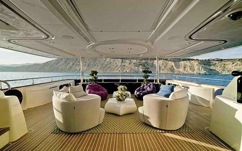 a room with a table and chairs aboard BUNKER Yacht for Sale