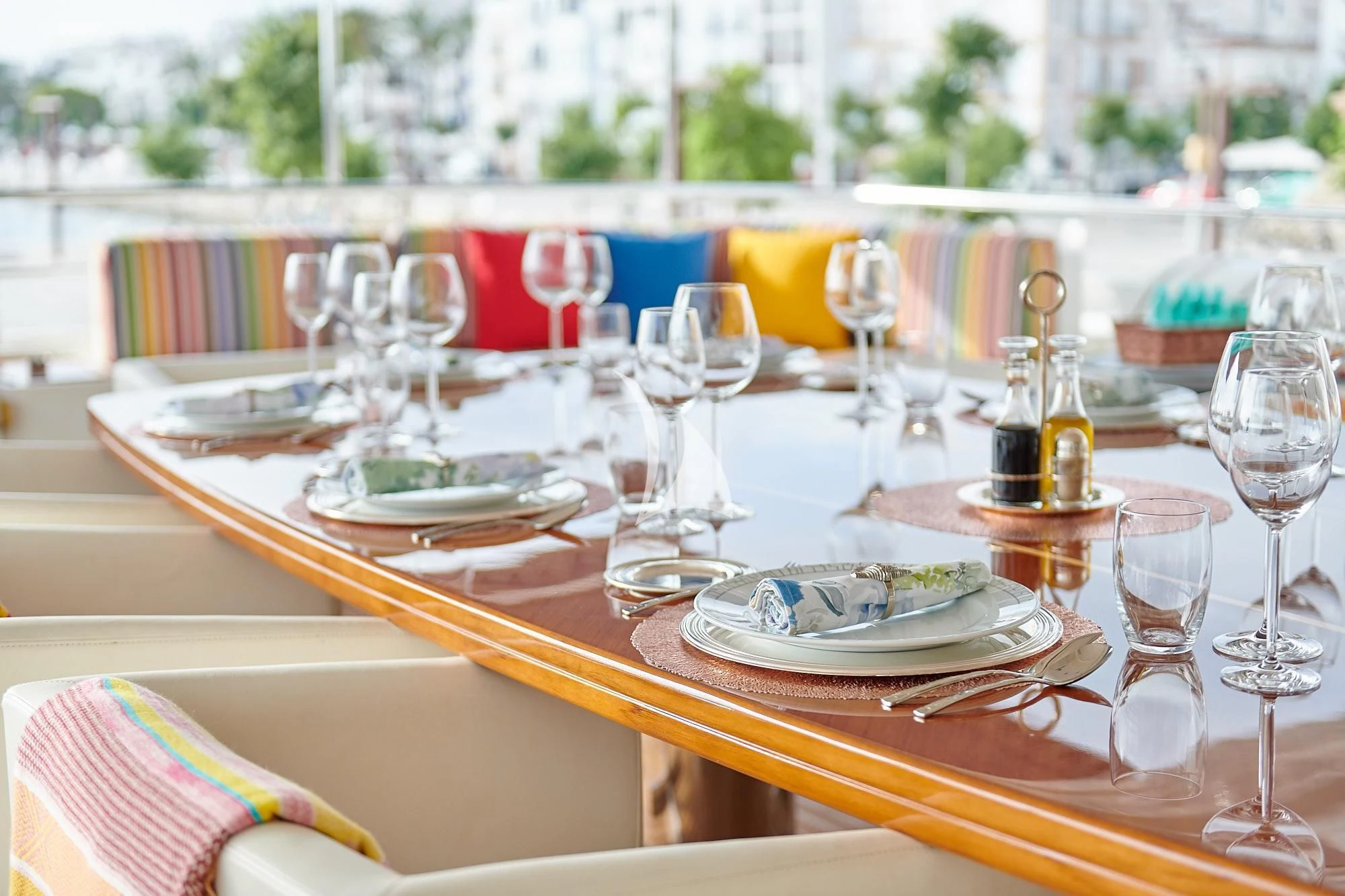 a table set with wine glasses aboard BUNKER Yacht for Sale