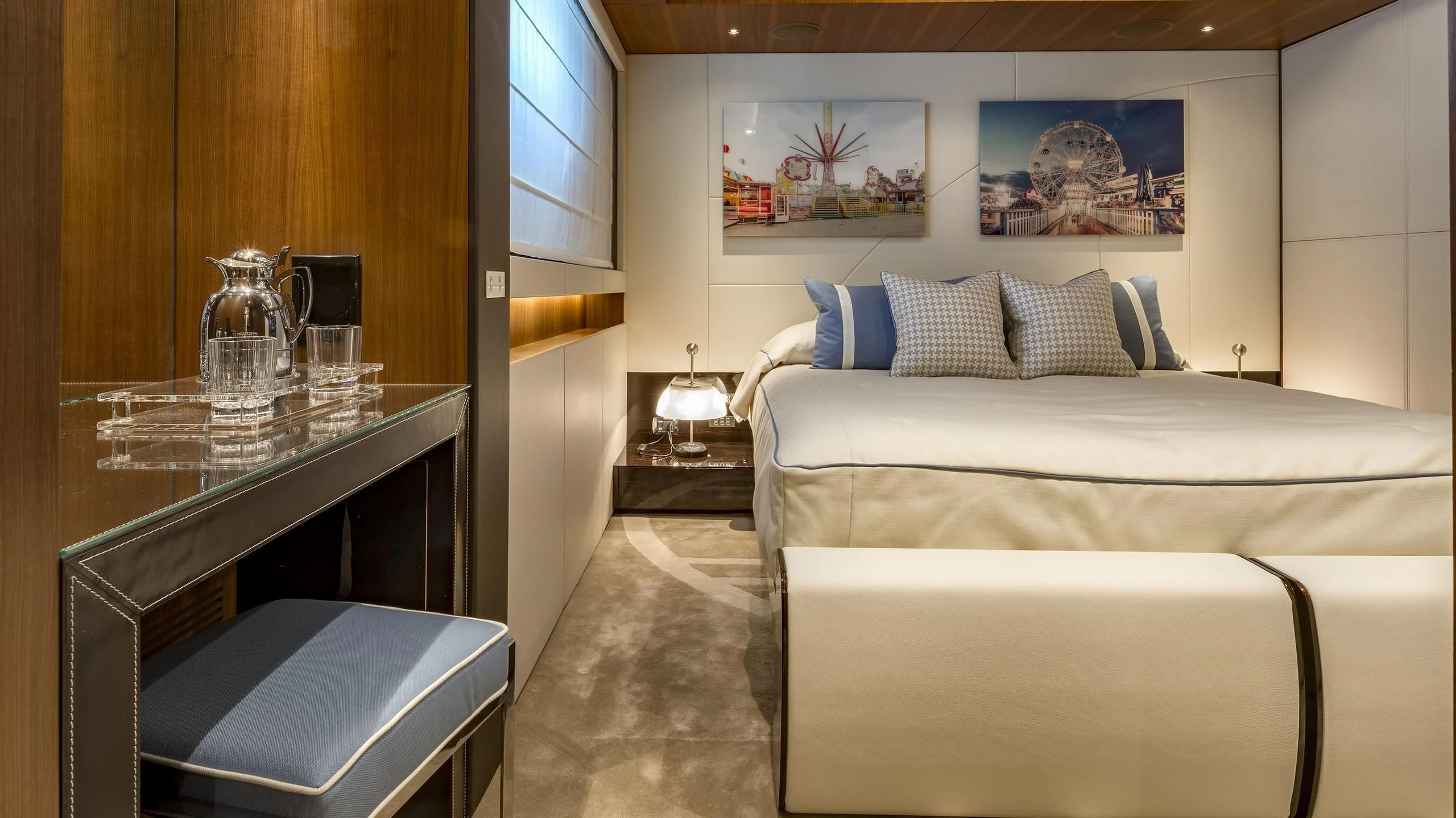 a room with a bed and a table aboard TALEYA Yacht for Sale
