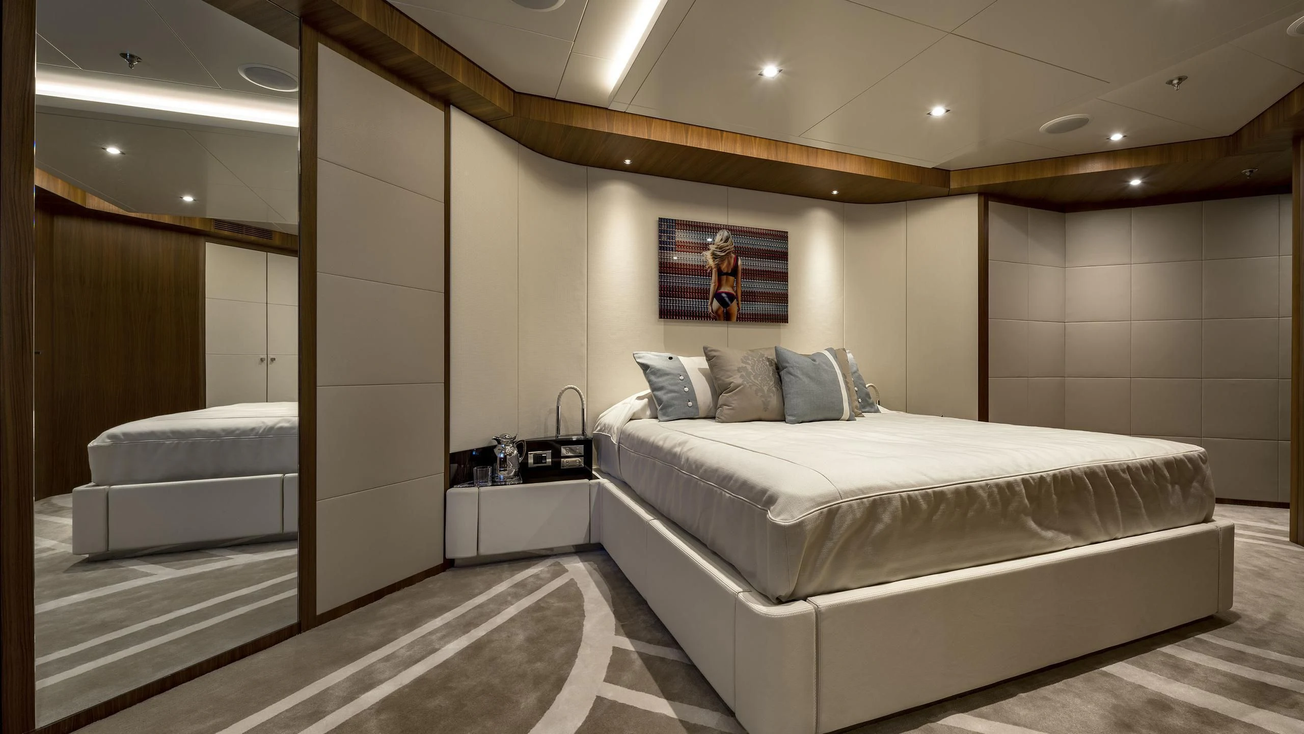 a room with a bed and a desk aboard TALEYA Yacht for Sale
