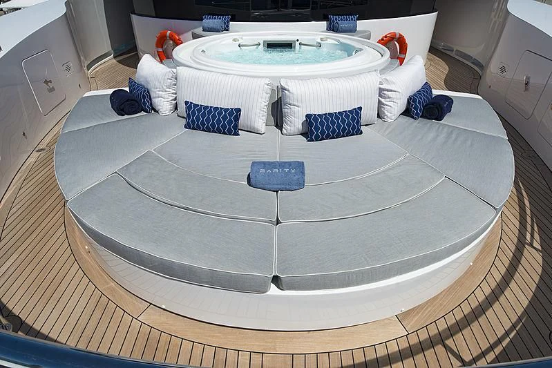 a white bathtub with blue and white towels aboard TALEYA Yacht for Sale
