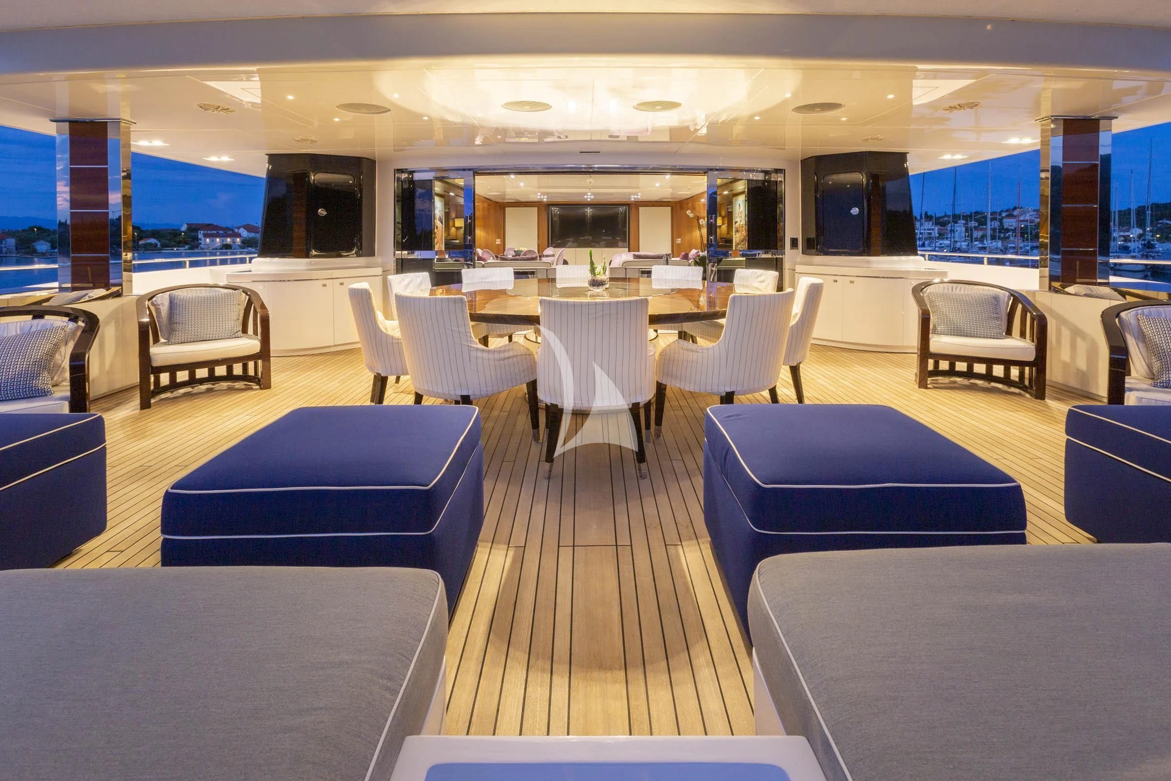 a room with tables and chairs aboard TALEYA Yacht for Sale