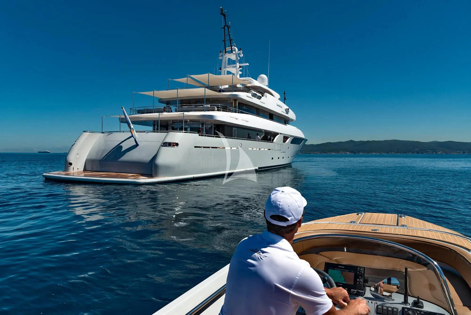 a man on a boat aboard TALEYA Yacht for Sale