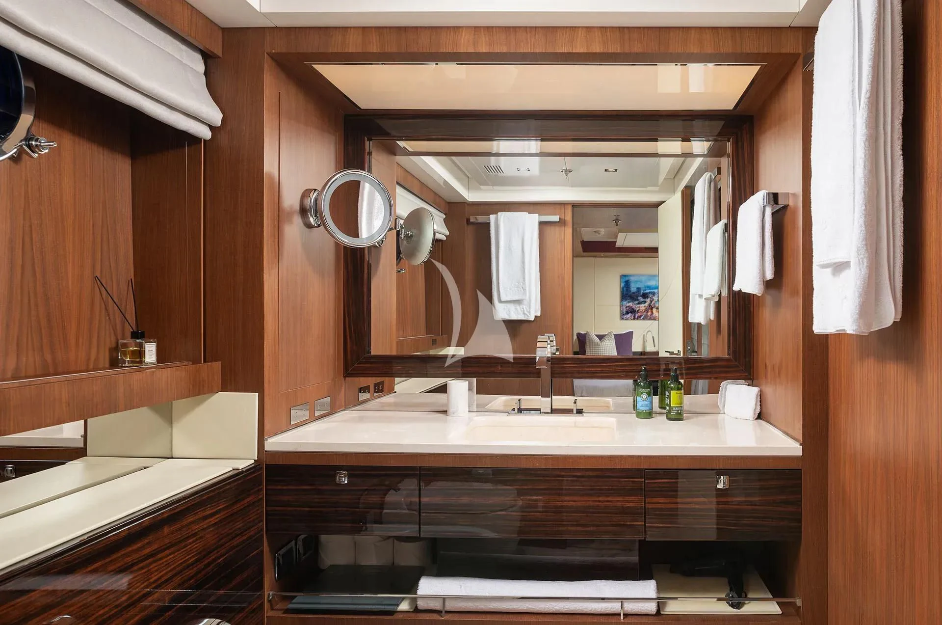 a bathroom with a large mirror aboard TALEYA Yacht for Sale