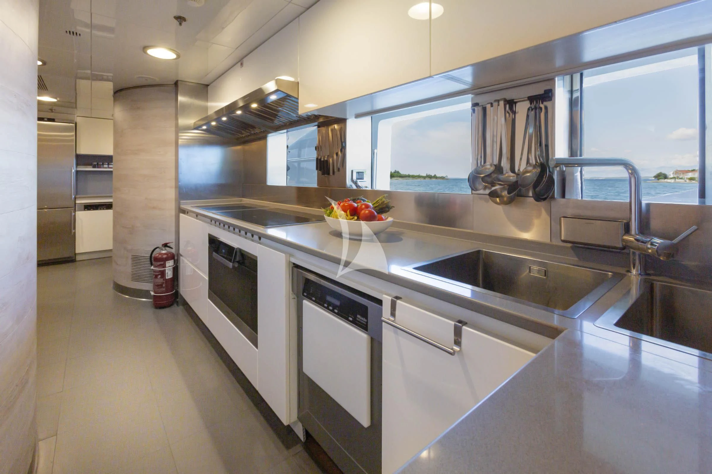 a kitchen with stainless steel appliances aboard TALEYA Yacht for Sale