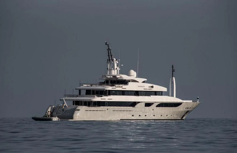 a large white ship in the water aboard TALEYA Yacht for Sale