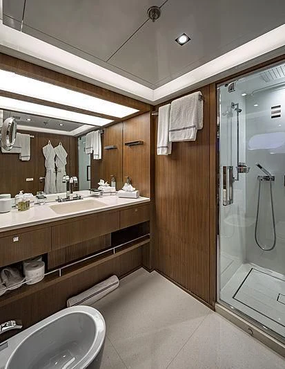 a bathroom with a sink and a mirror aboard TALEYA Yacht for Sale