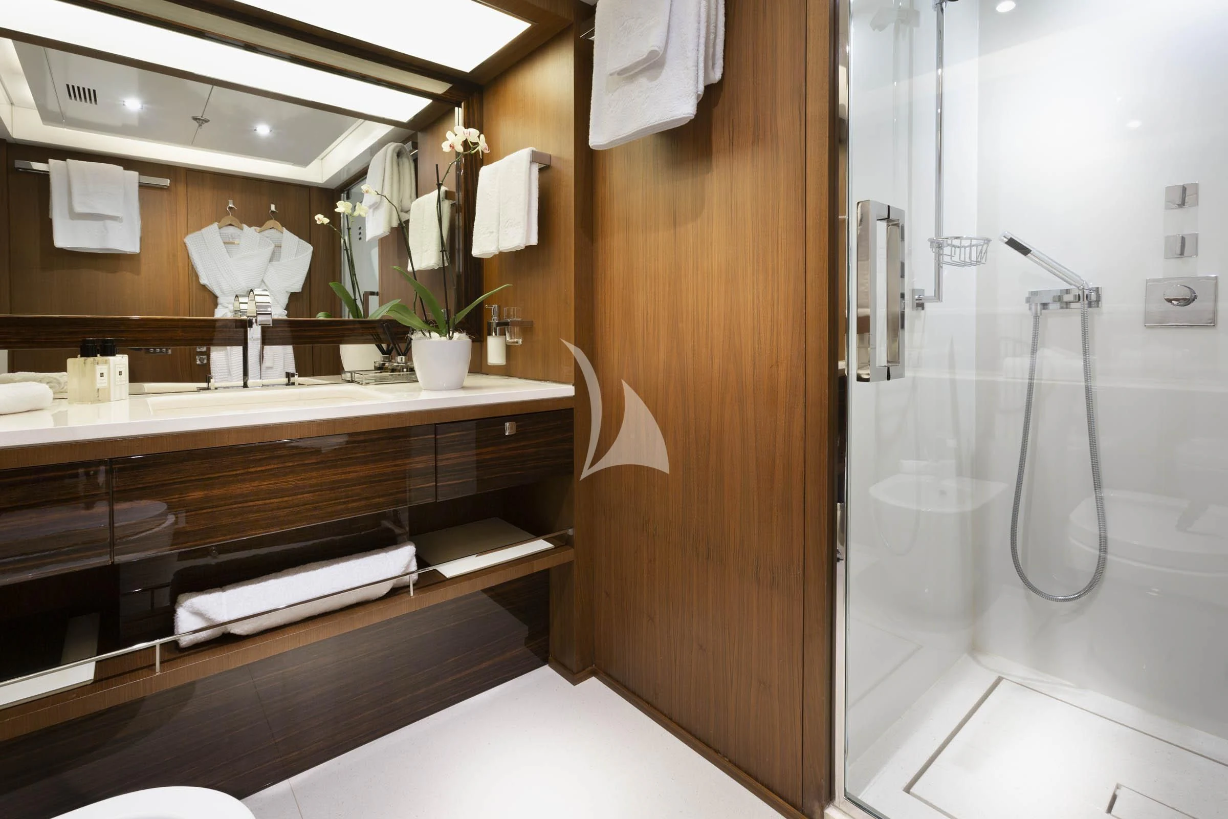 a bathroom with a large mirror aboard TALEYA Yacht for Sale