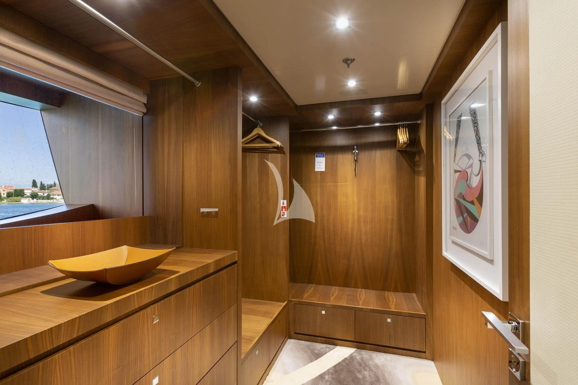 a bathroom with a countertop sink and a large mirror aboard TALEYA Yacht for Sale