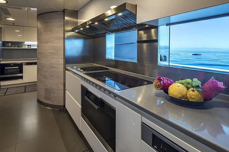 a kitchen with a large island aboard TALEYA Yacht for Sale