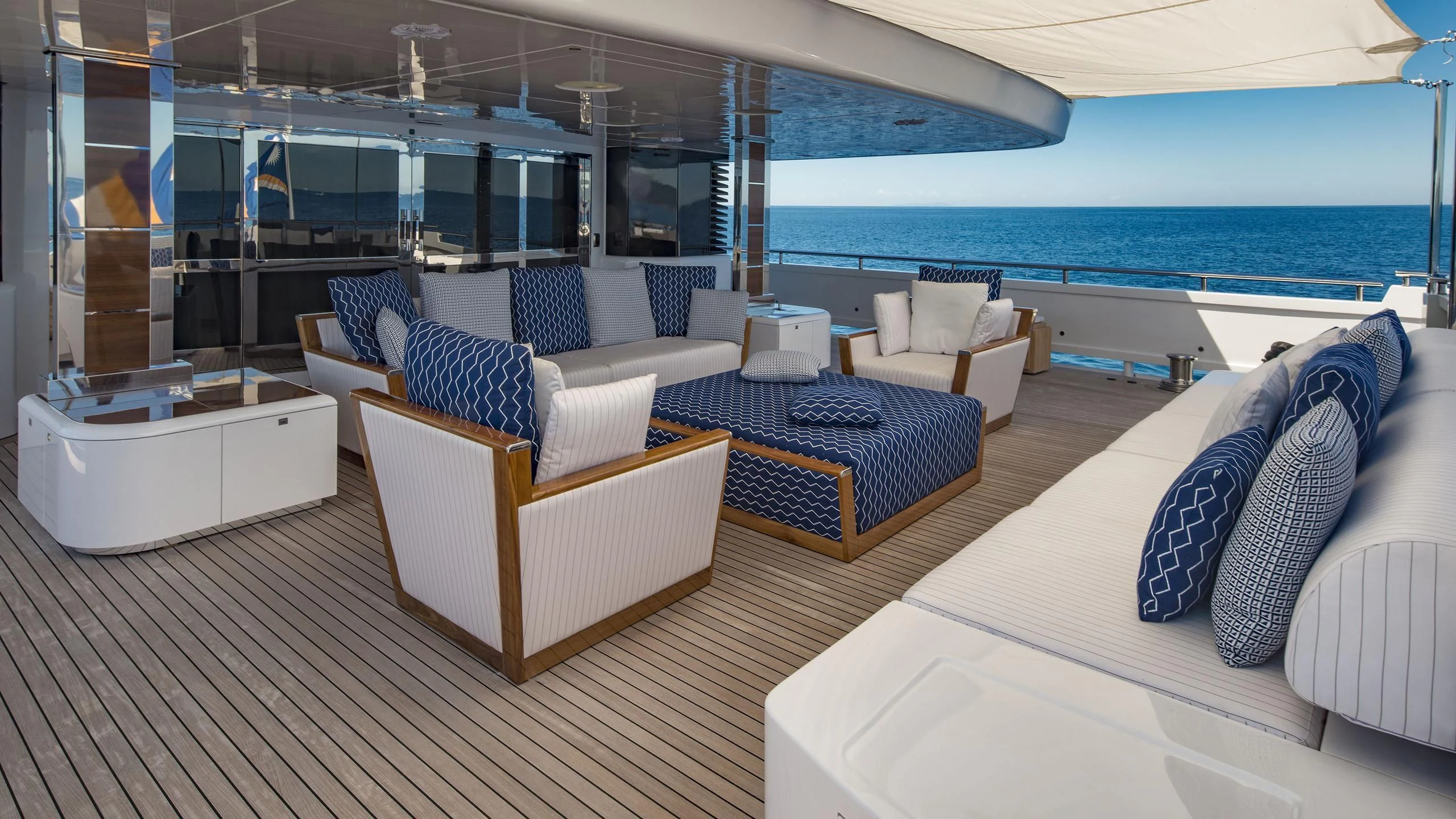 a room with a bed and a chair aboard TALEYA Yacht for Sale