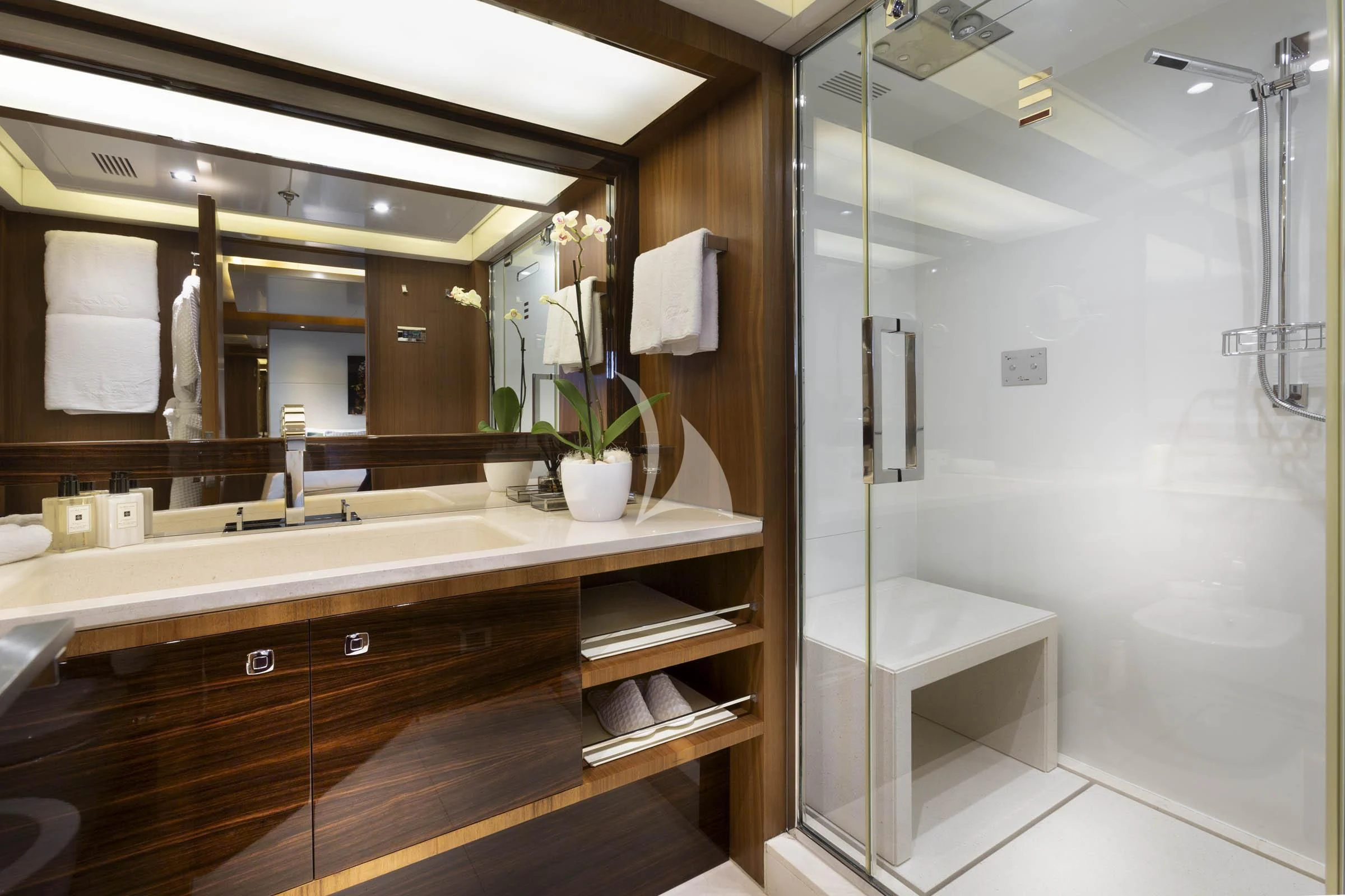a bathroom with a large mirror aboard TALEYA Yacht for Sale