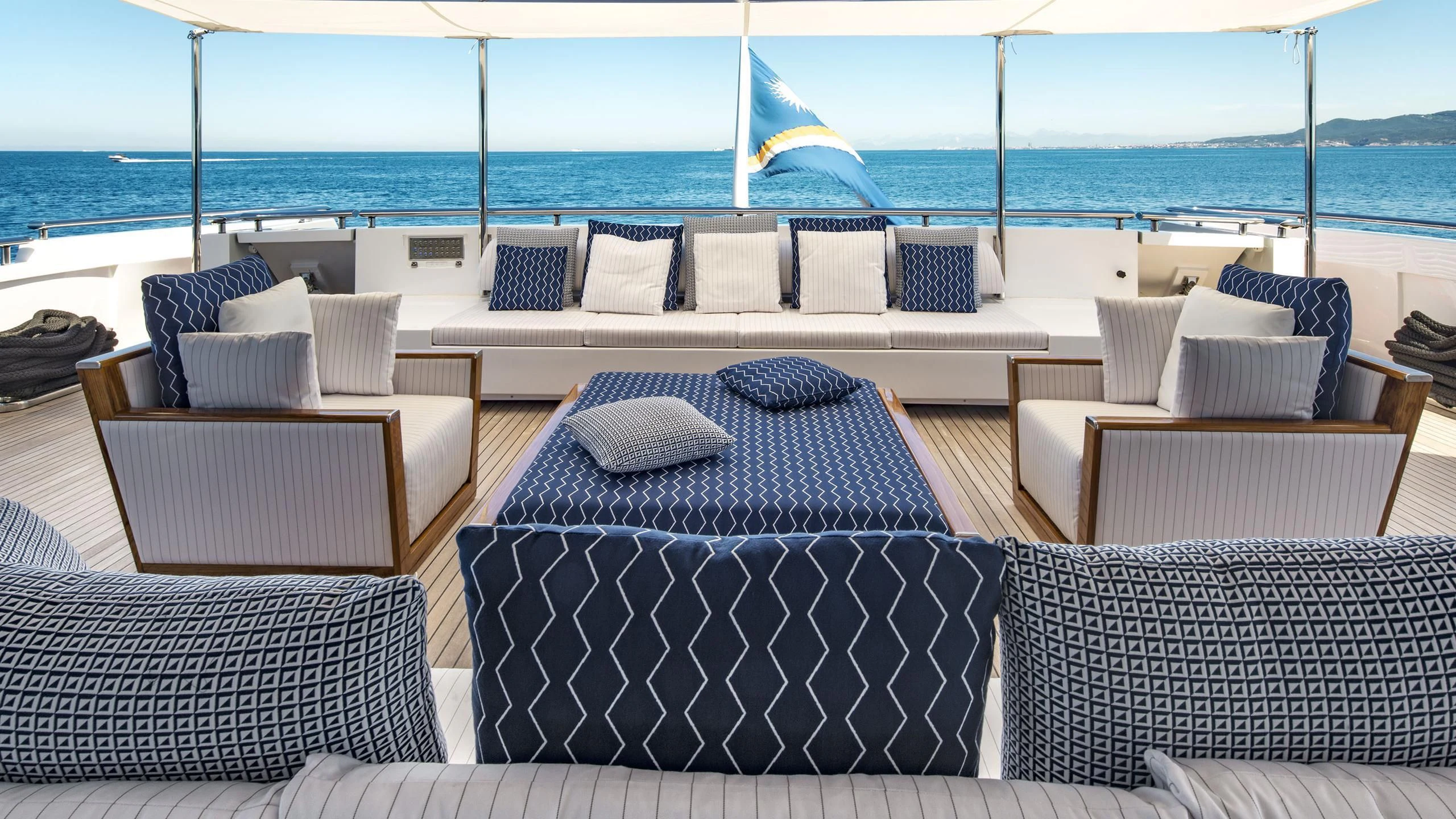 a room with couches and chairs aboard TALEYA Yacht for Sale