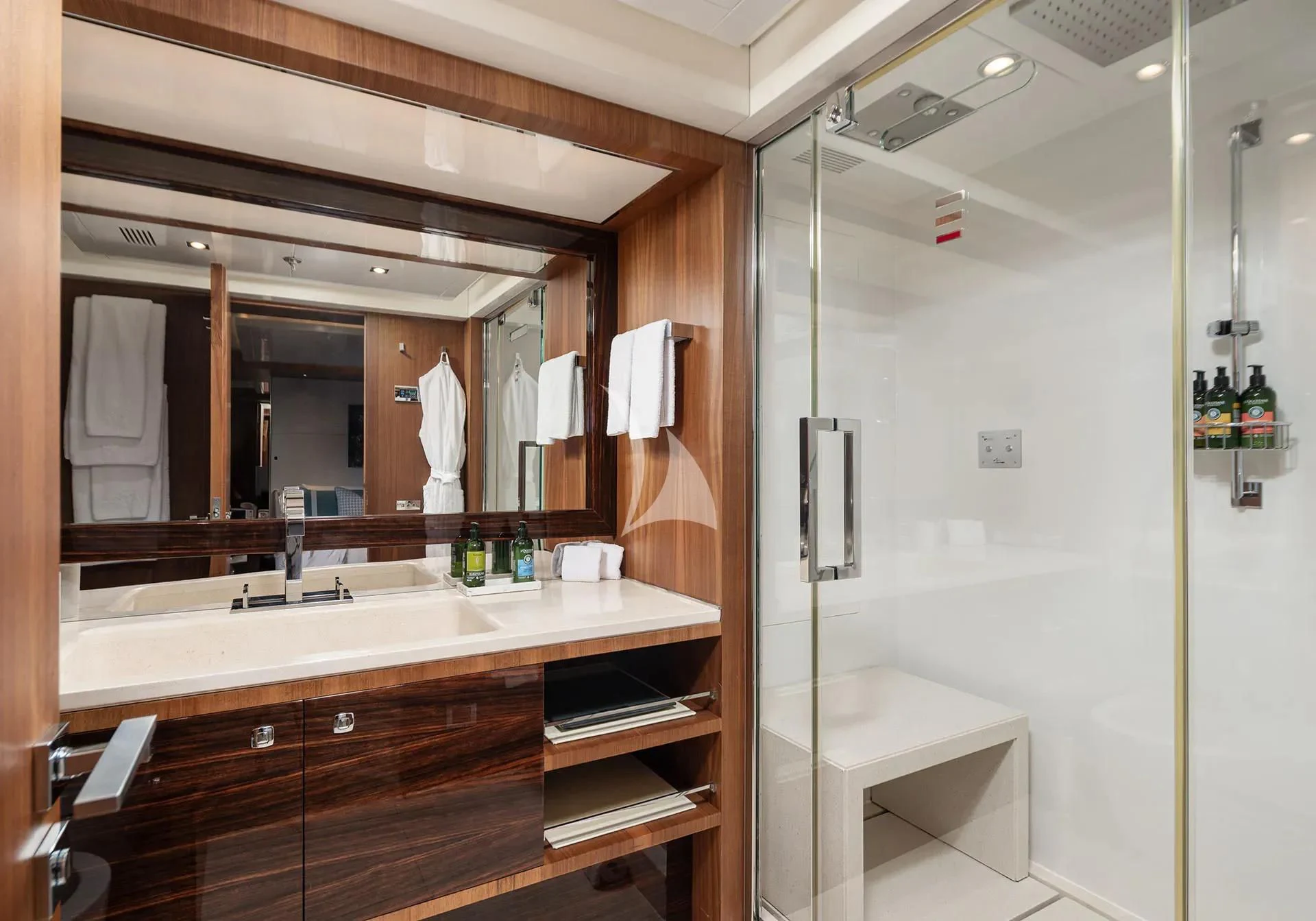 a bathroom with a large mirror aboard TALEYA Yacht for Sale