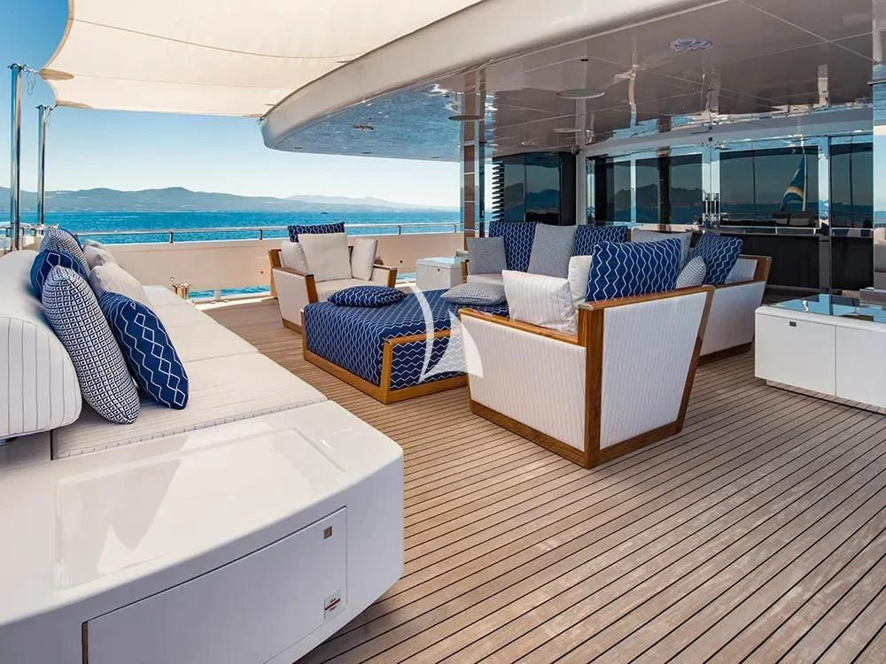 a room with a view of the ocean and the deck aboard TALEYA Yacht for Sale