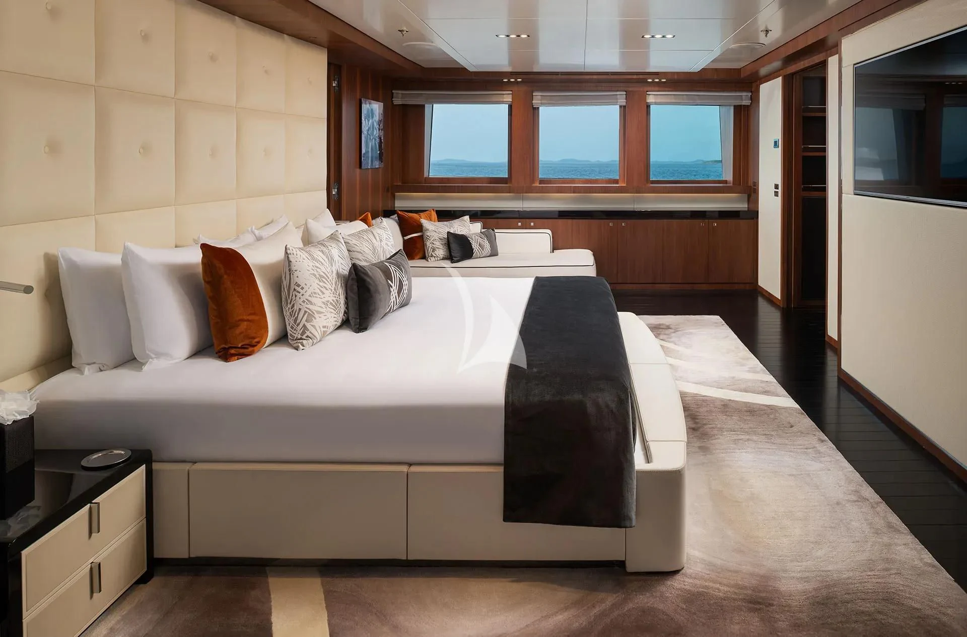 a bed with pillows on it aboard TALEYA Yacht for Sale