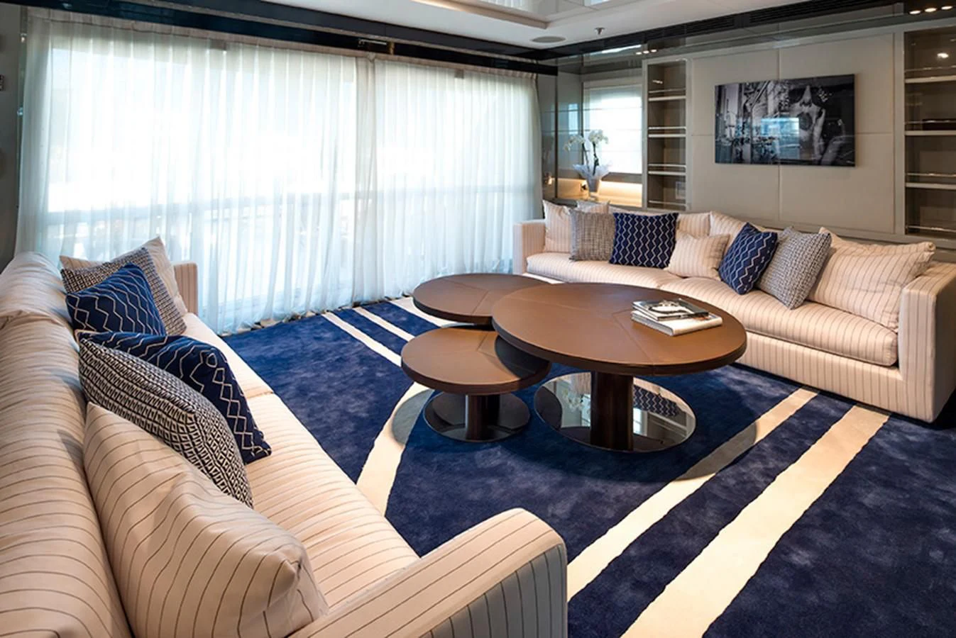 a living room with a couch and a coffee table aboard TALEYA Yacht for Sale