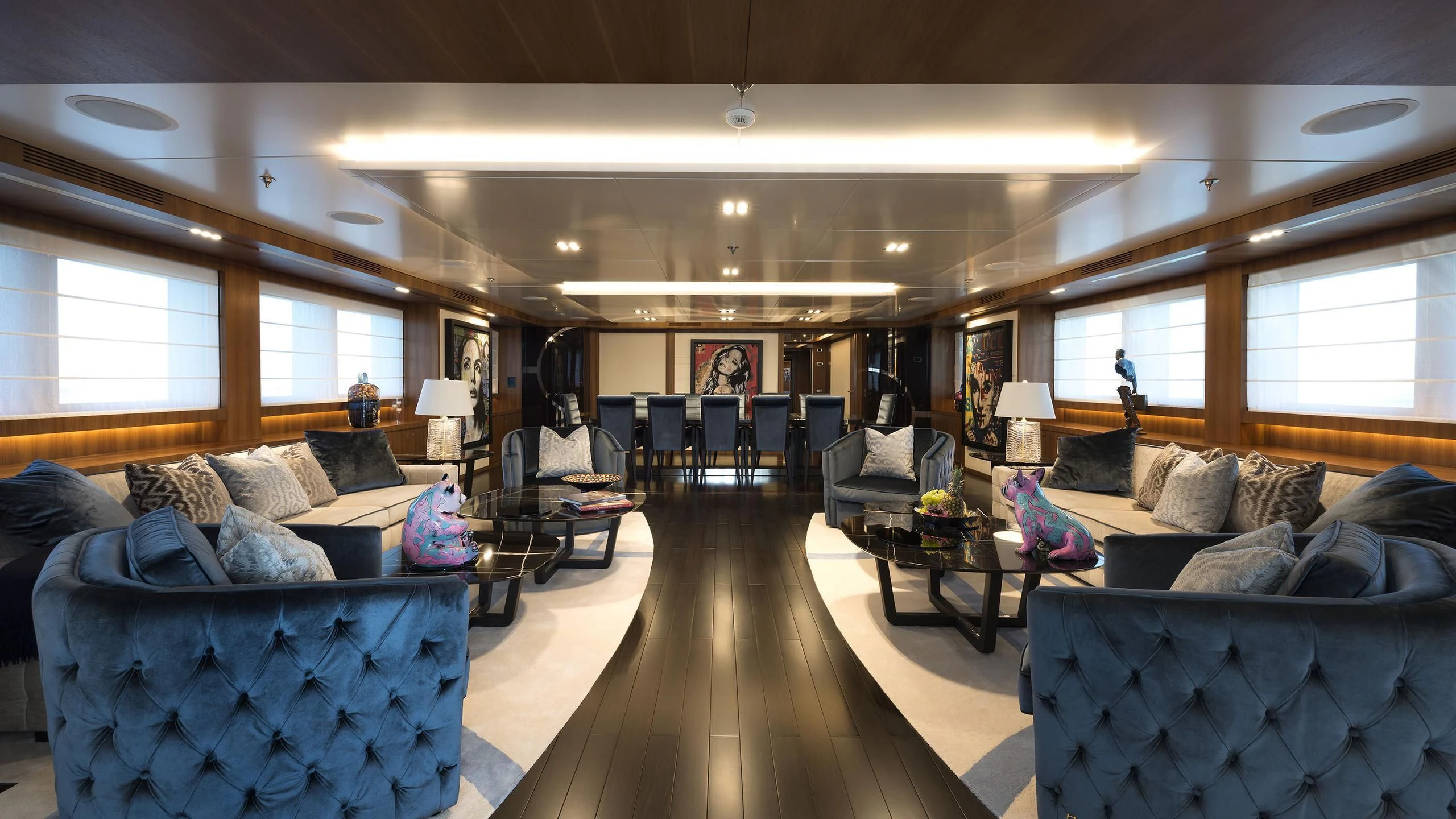 a living room with a large window aboard TALEYA Yacht for Sale