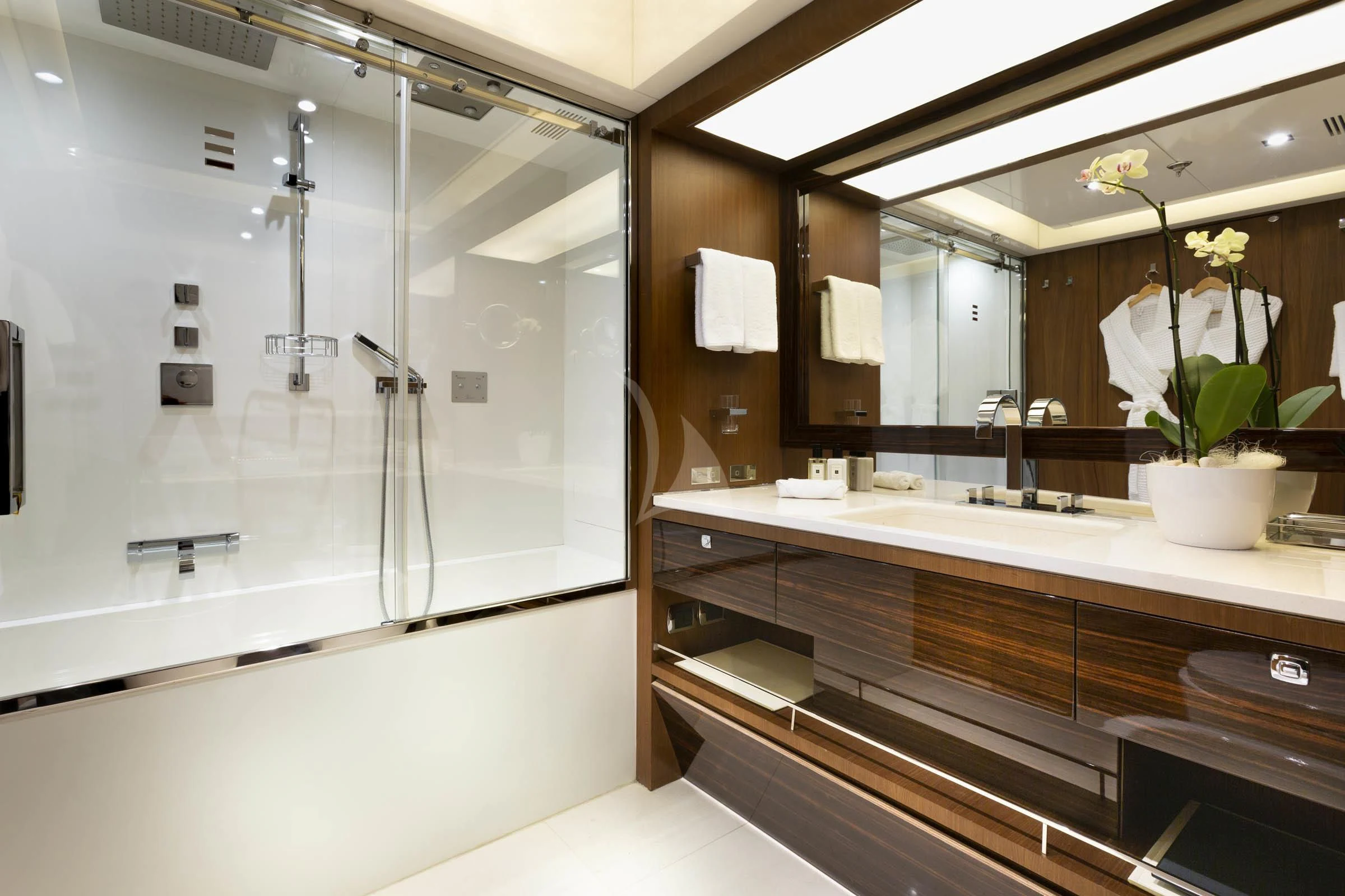 a bathroom with a large mirror aboard TALEYA Yacht for Sale
