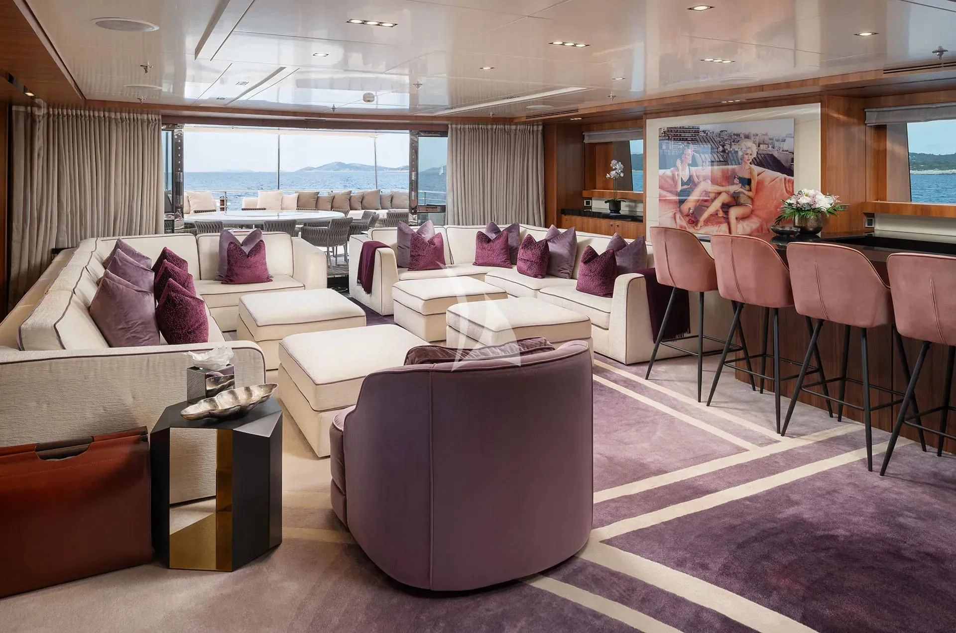a room with a couch and a table aboard TALEYA Yacht for Sale