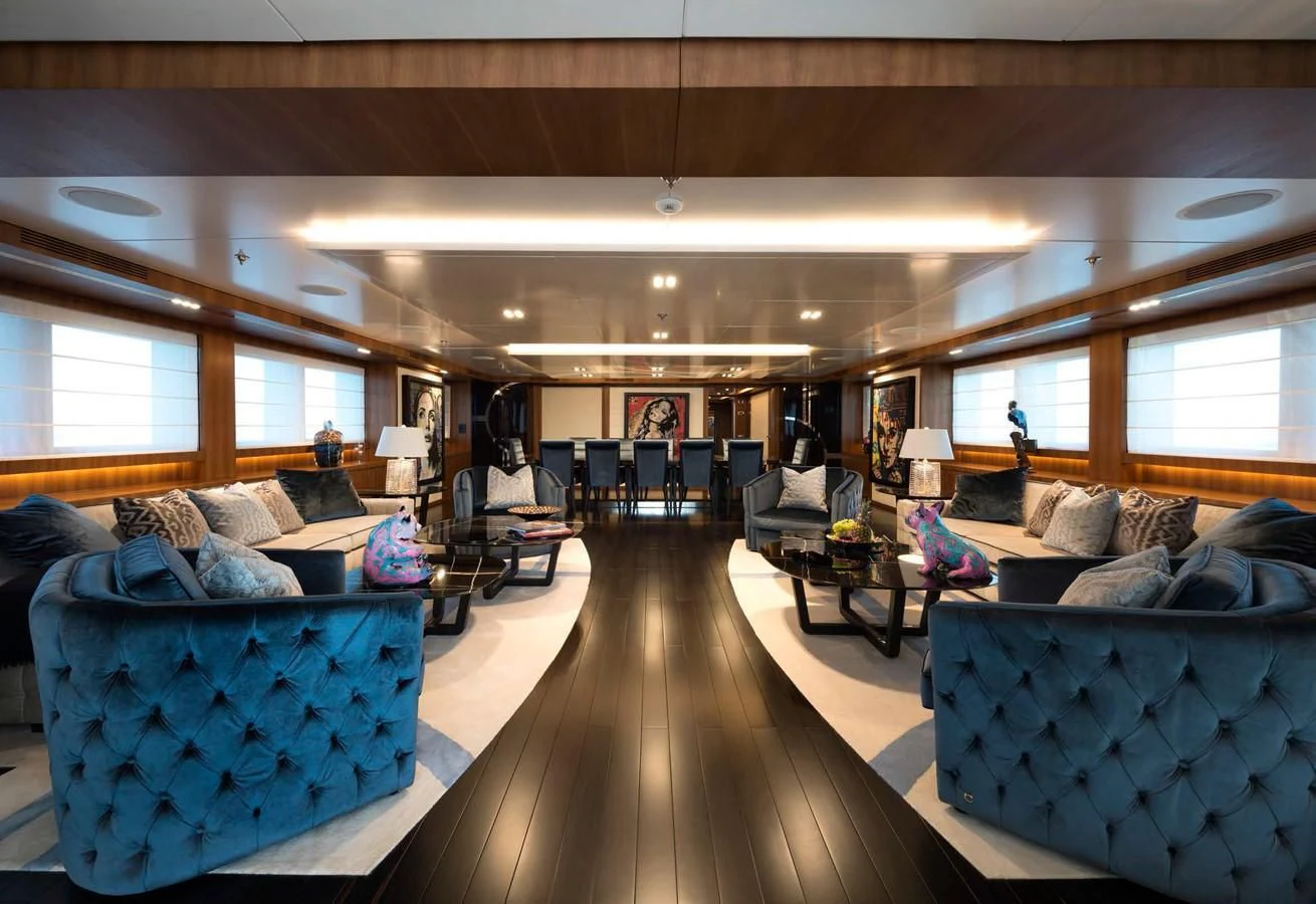 a living room with a large window aboard TALEYA Yacht for Sale
