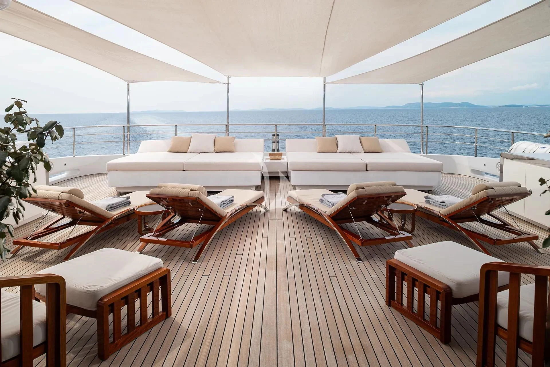 a room with a view of the ocean and a deck aboard TALEYA Yacht for Sale