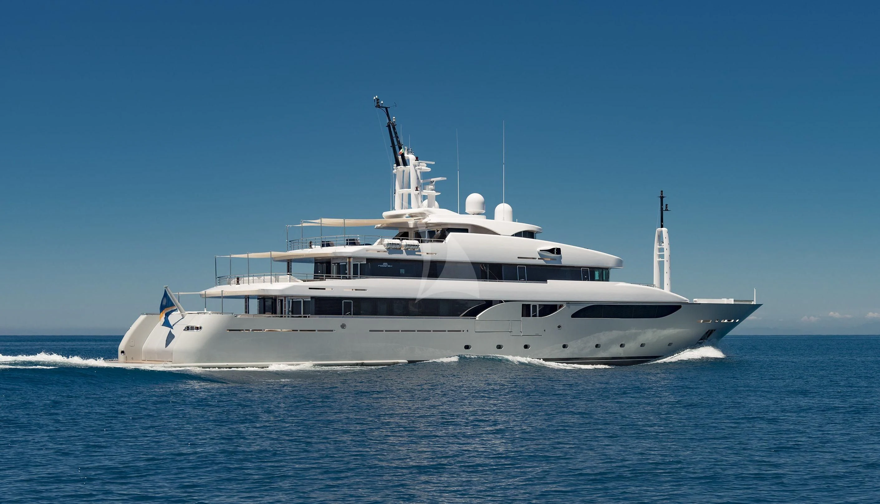 a white yacht on the water aboard TALEYA Yacht for Sale