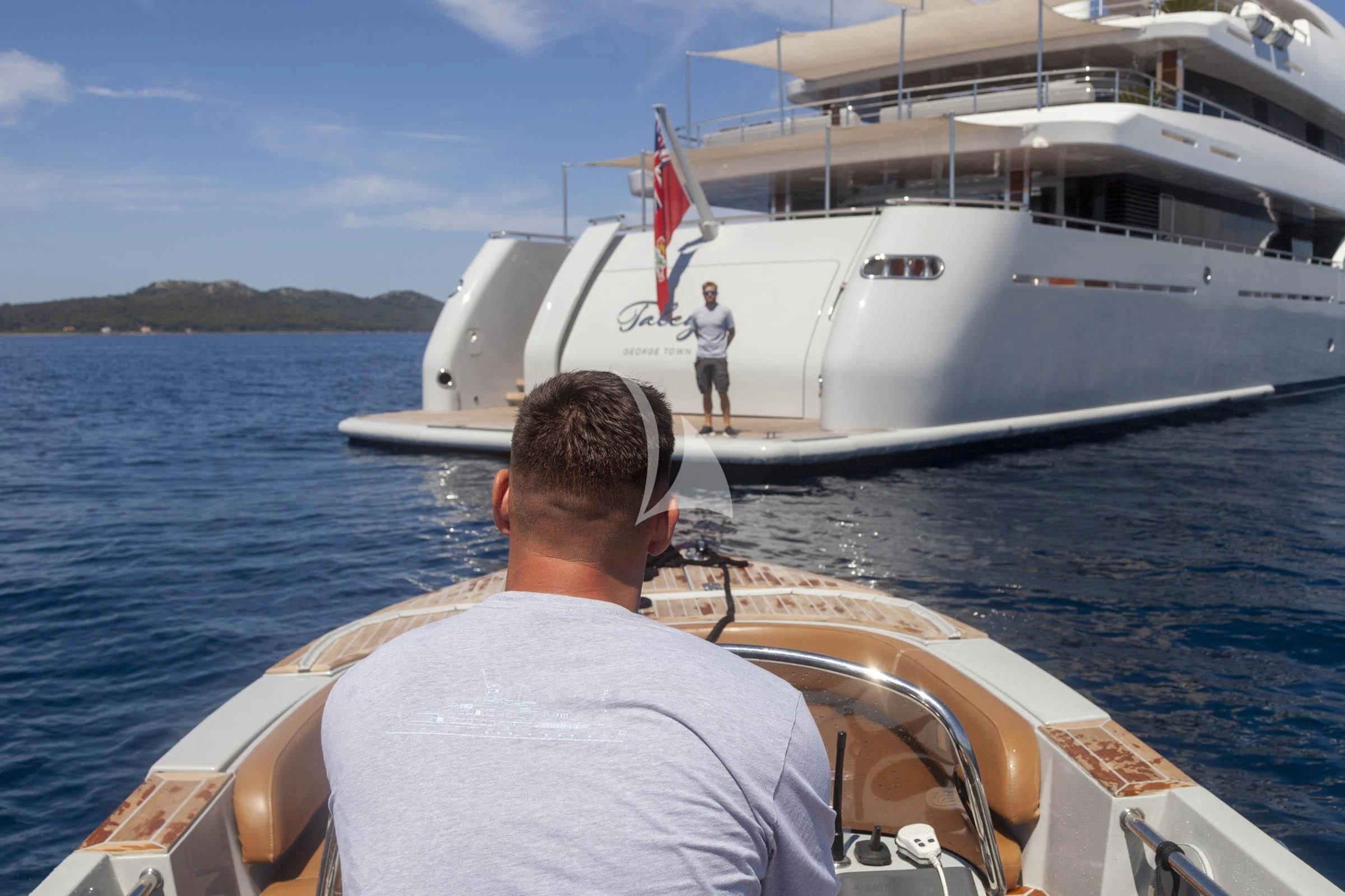 a man on a boat aboard TALEYA Yacht for Sale