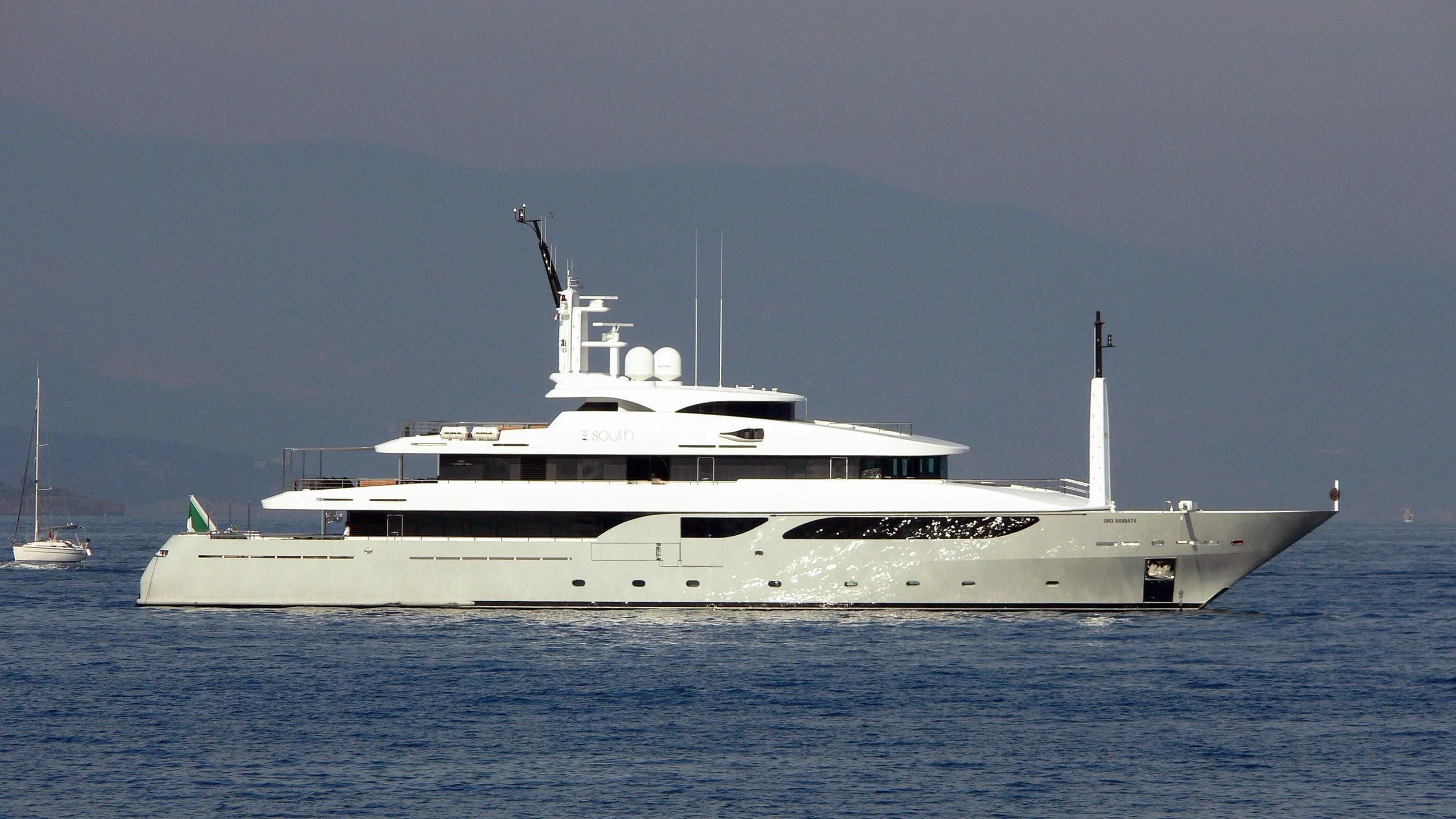 a large white ship in the water aboard TALEYA Yacht for Sale