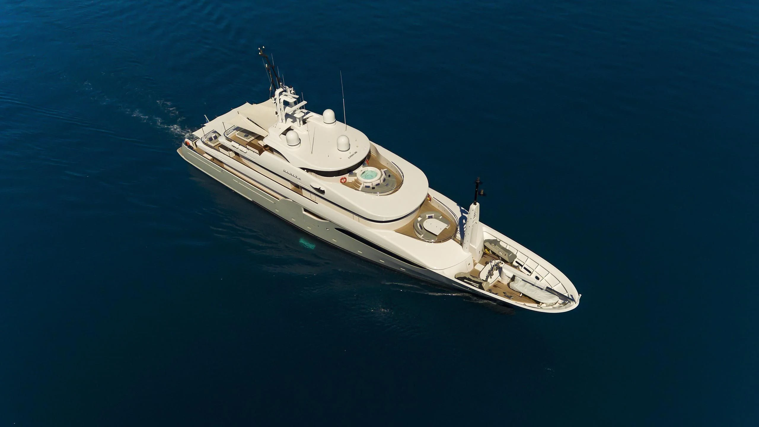 a white boat in the water aboard TALEYA Yacht for Sale