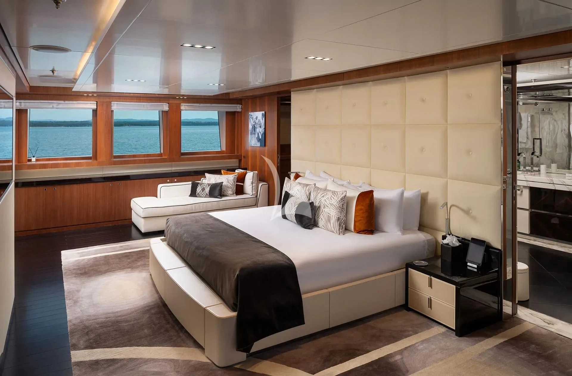 a room with a bed and a desk aboard TALEYA Yacht for Sale