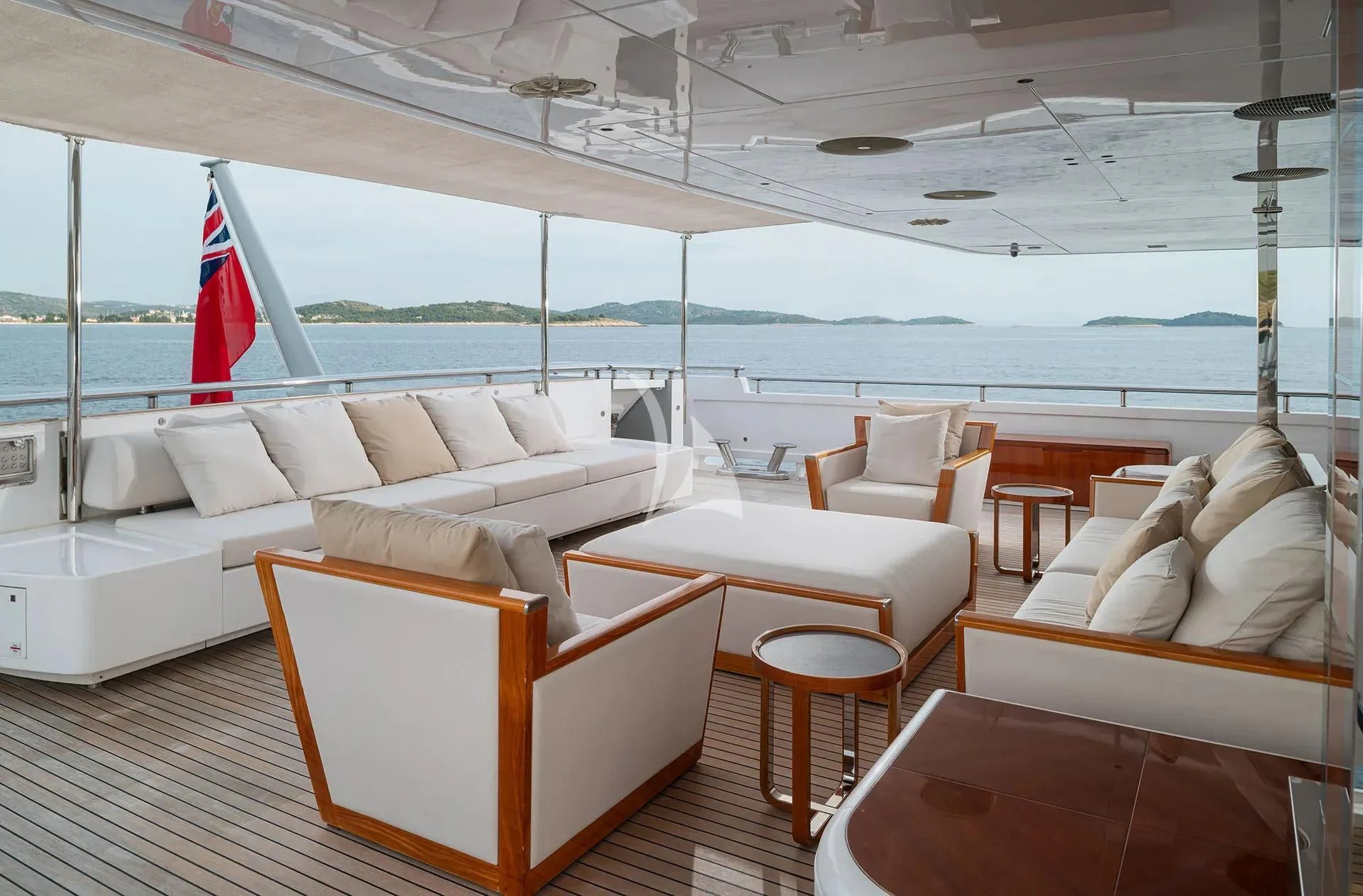 a boat with a large white sofa and chairs aboard TALEYA Yacht for Sale