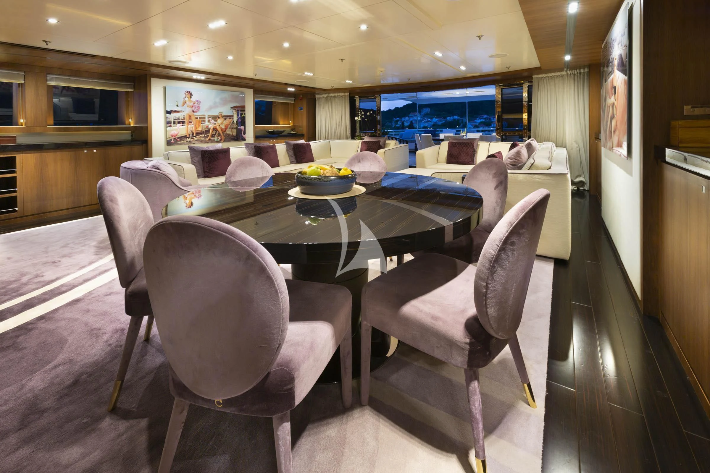 a dining room with a table and chairs aboard TALEYA Yacht for Sale