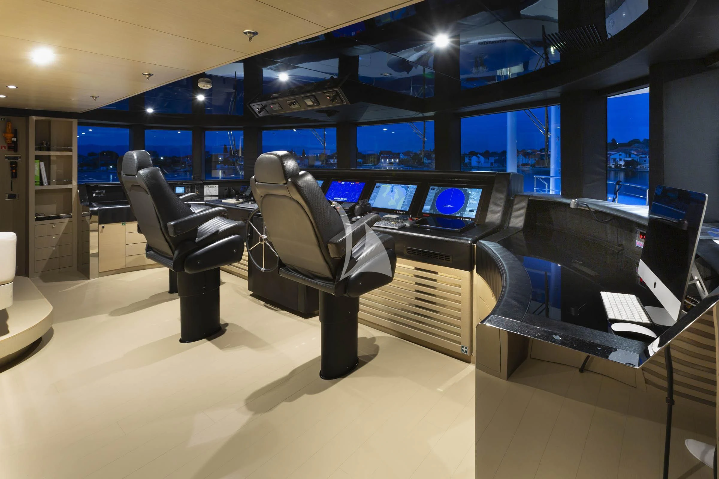 a room with computers and chairs aboard TALEYA Yacht for Sale