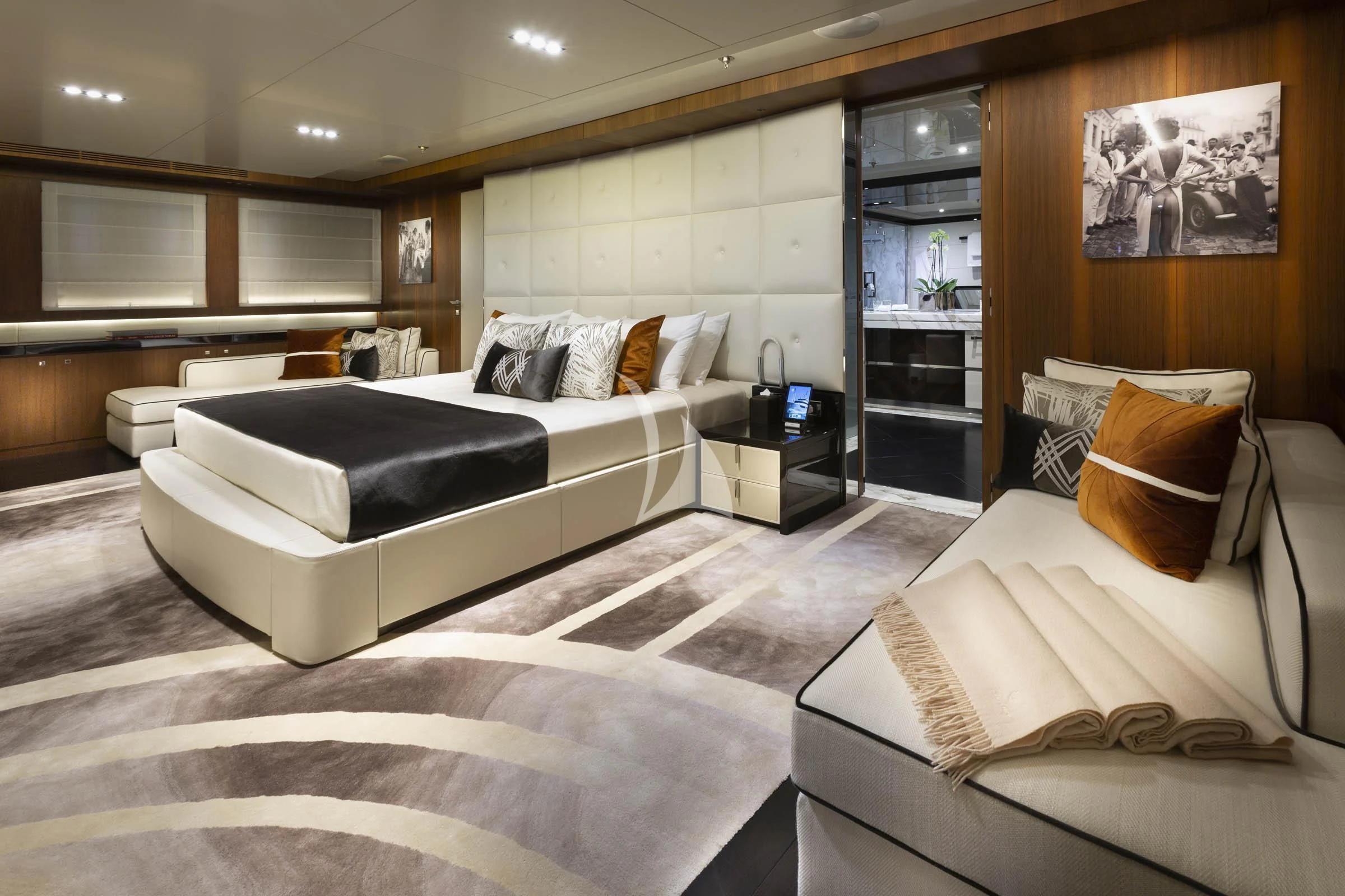 a room with a bed and a couch aboard TALEYA Yacht for Sale