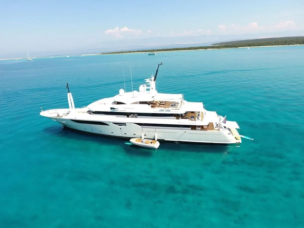 a large white boat in the water aboard TALEYA Yacht for Sale