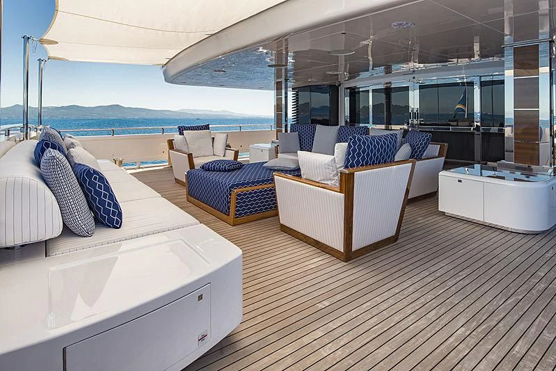 a room with a bed and a view of the ocean aboard TALEYA Yacht for Sale