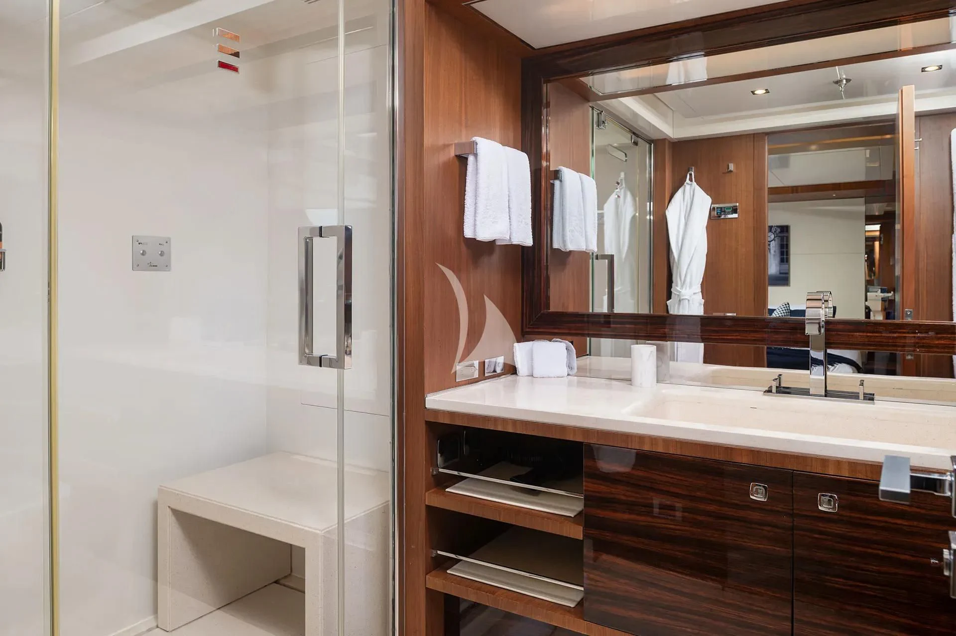 a bathroom with a large mirror aboard TALEYA Yacht for Sale
