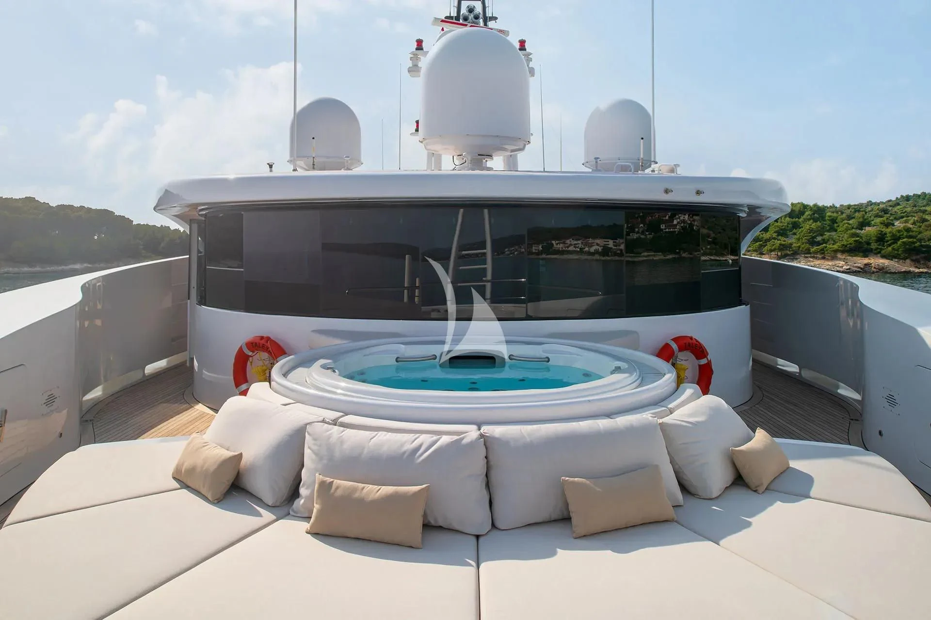 a large white and blue pool with rocks and a large white dome on top of it aboard TALEYA Yacht for Sale