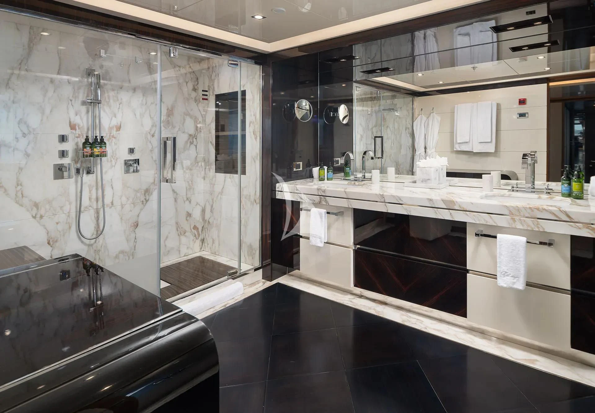 a large bathroom with a large shower aboard TALEYA Yacht for Sale