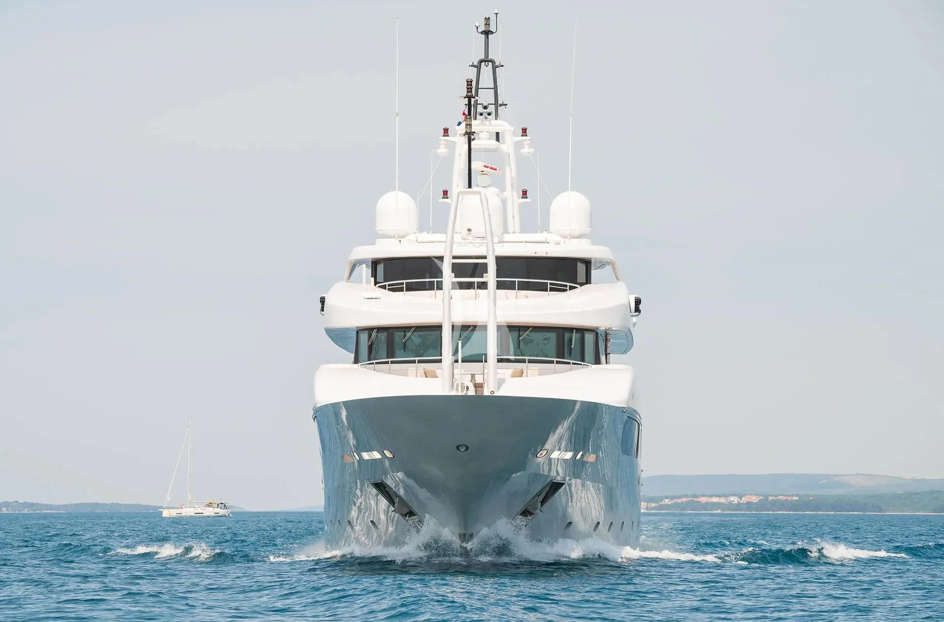 a white boat in the water aboard TALEYA Yacht for Sale