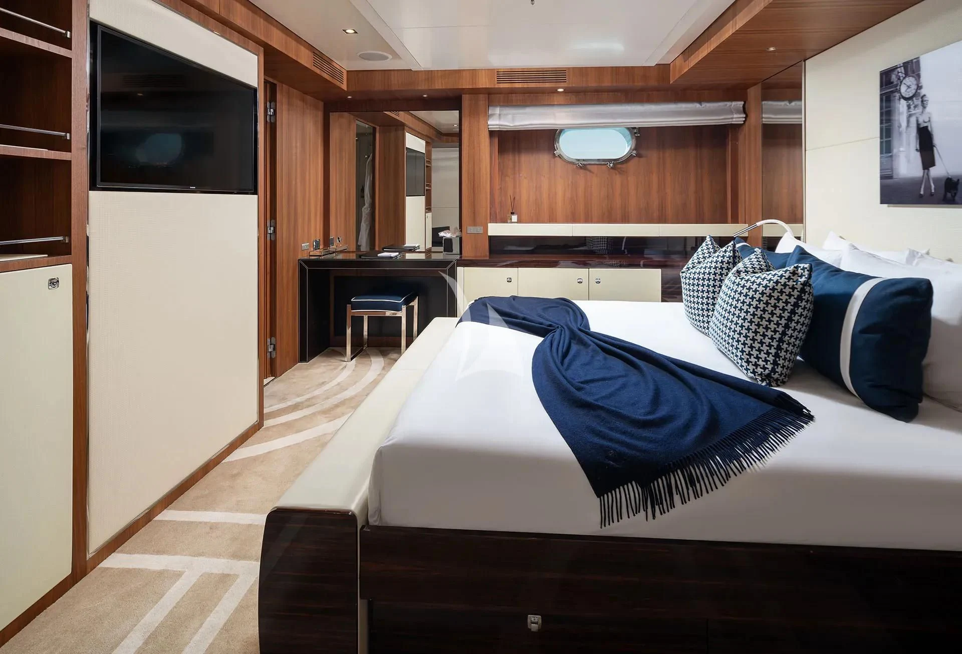 a bedroom with a bed and a microwave aboard TALEYA Yacht for Sale
