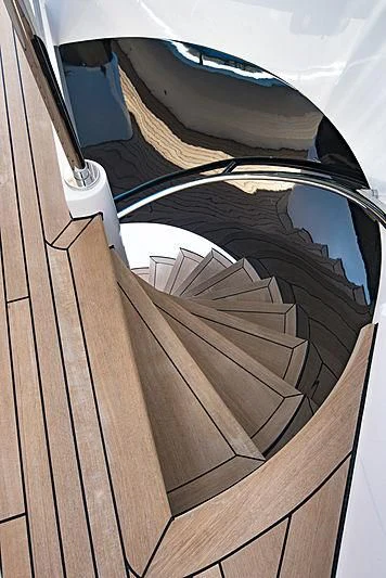a wooden floor with a black and white object on it aboard TALEYA Yacht for Sale