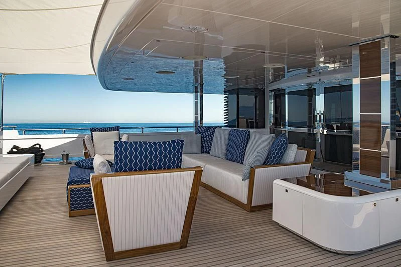 a room with couches and a table aboard TALEYA Yacht for Sale
