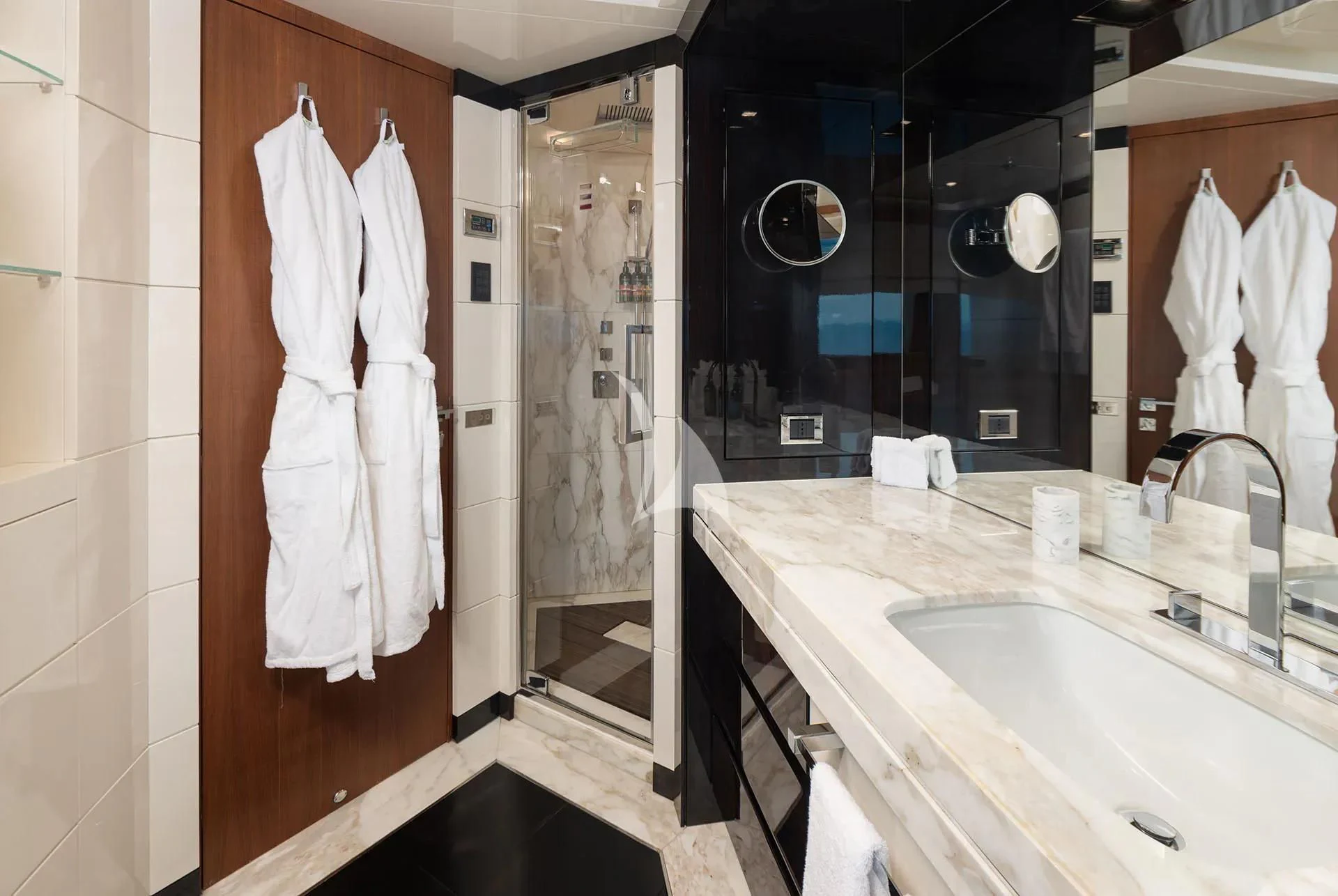 a bathroom with a sink and a mirror aboard TALEYA Yacht for Sale